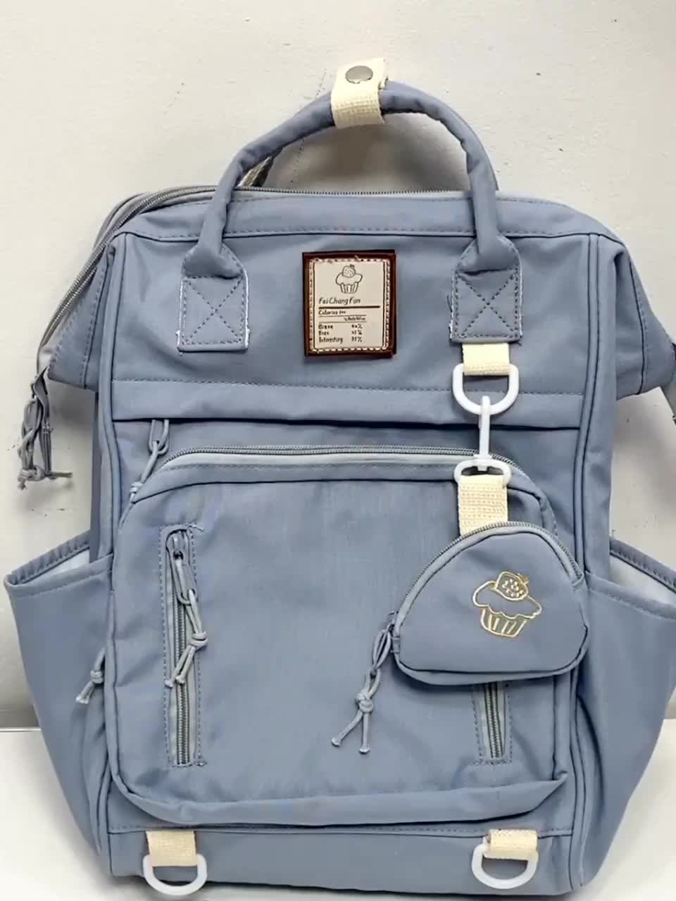 Tas impor gaya Korea yang imut dengan sentuhan hati remaja, tas karung serbaguna cocok untuk suasana sekolah dan santai bisa digunakan sebagai tas tangan atau tas ransel,tas lucu praktis untuk pelajar dan perjalanan Wanita tas ransel sekolah cewek SJB01